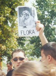 Dr. Brovina's son holding her picture at a rally in Prishtina, July 1999